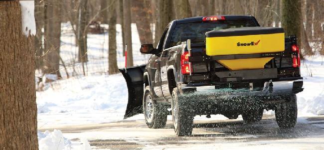 SnowEx Salt Spreader salting a road available at Markham Mower
